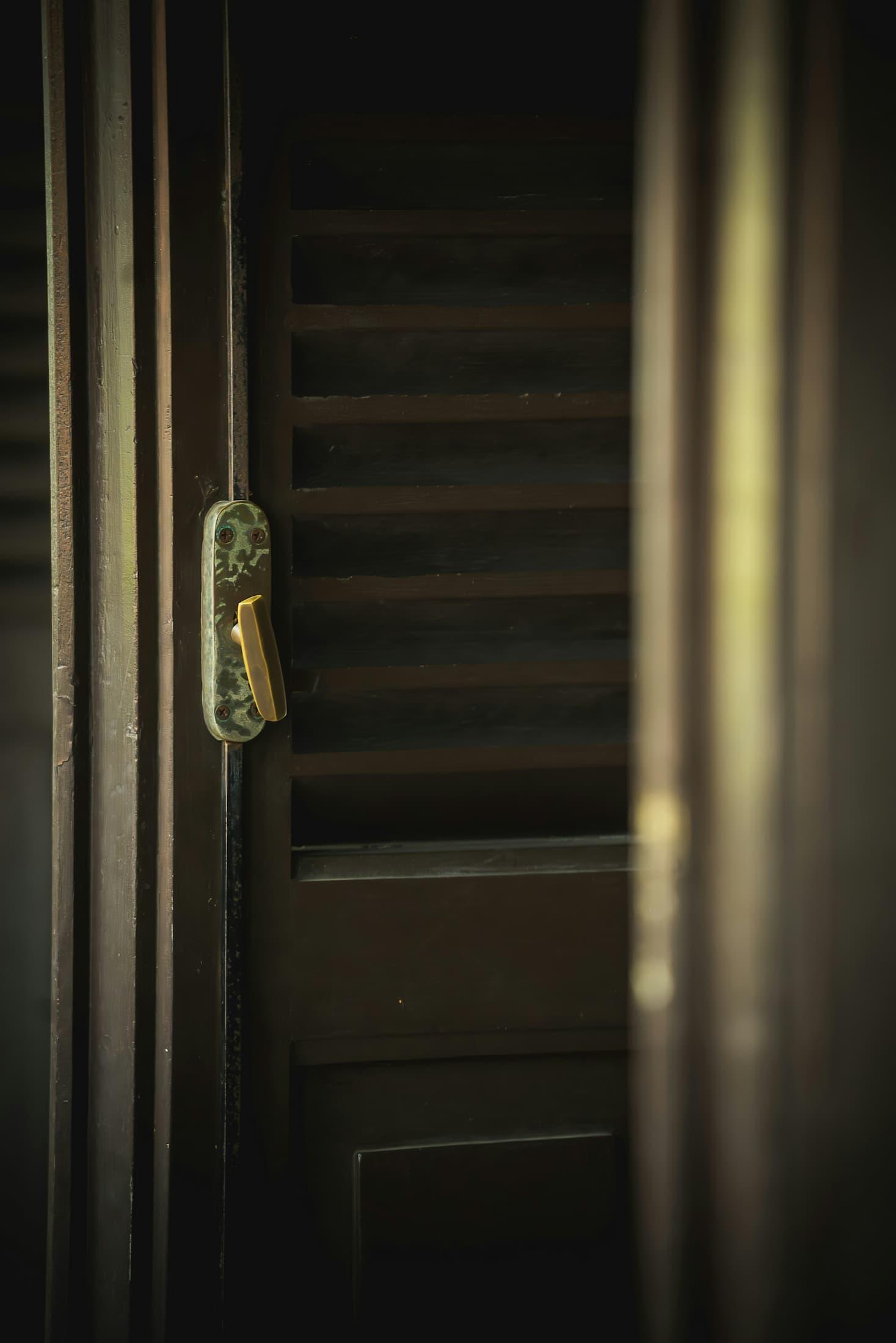 A person looking nervous before entering a family home